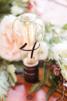 31 Unique Wedding Table Number Ideas - light bulb table number {Idalia Photography}