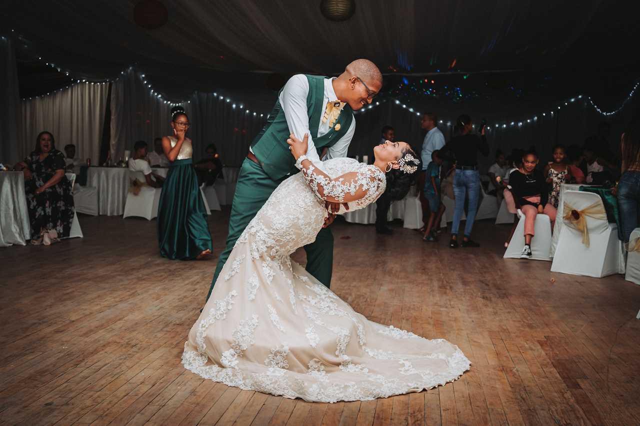 husband and bride enjoying their first dance