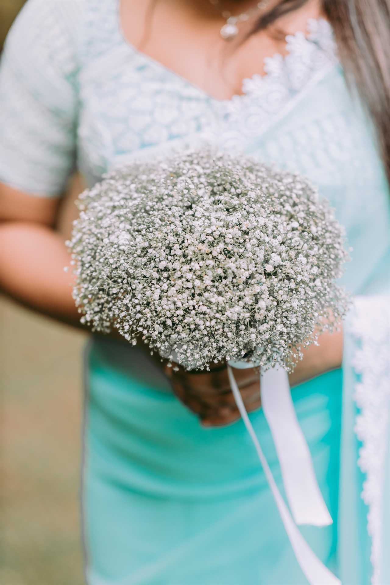 bride holding a simple bouquet