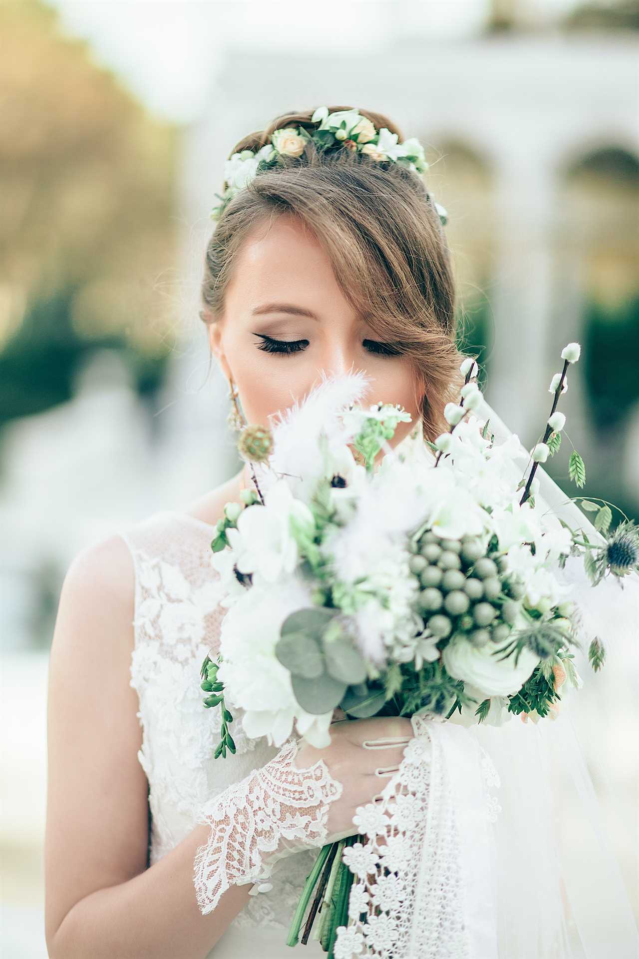bride holding a bouquet with Gardenias