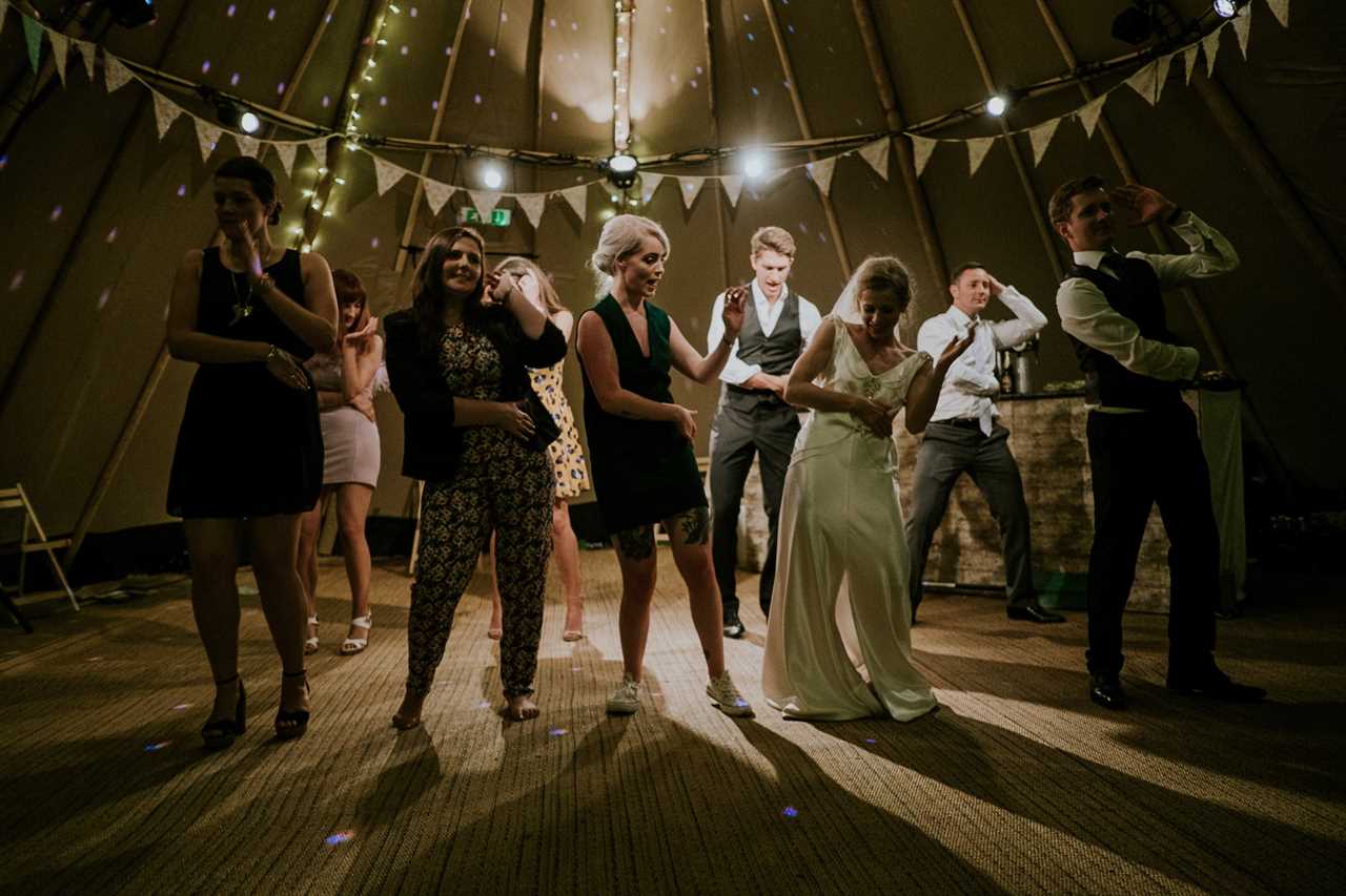 bride and wedding guests dancing