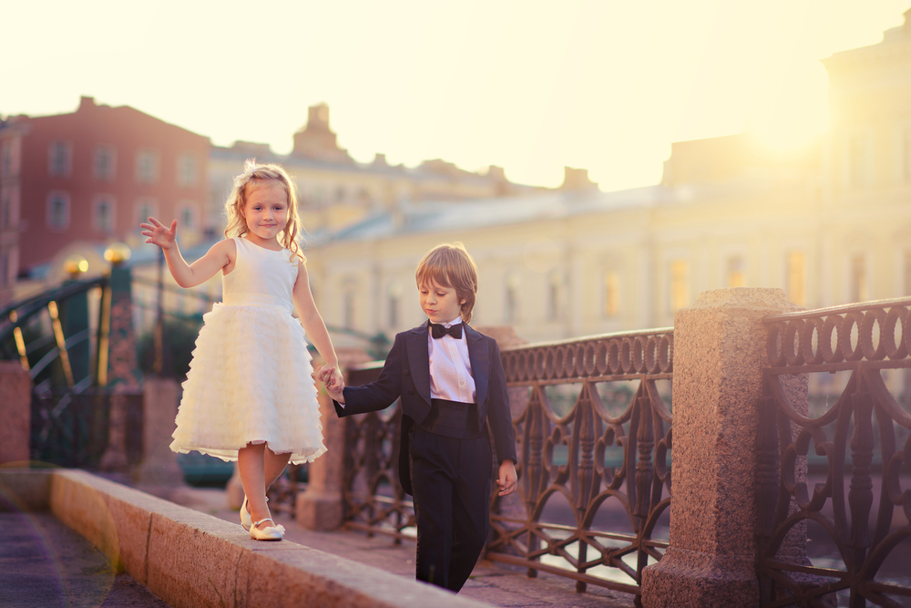 little boy and girl dressed like bride and groom