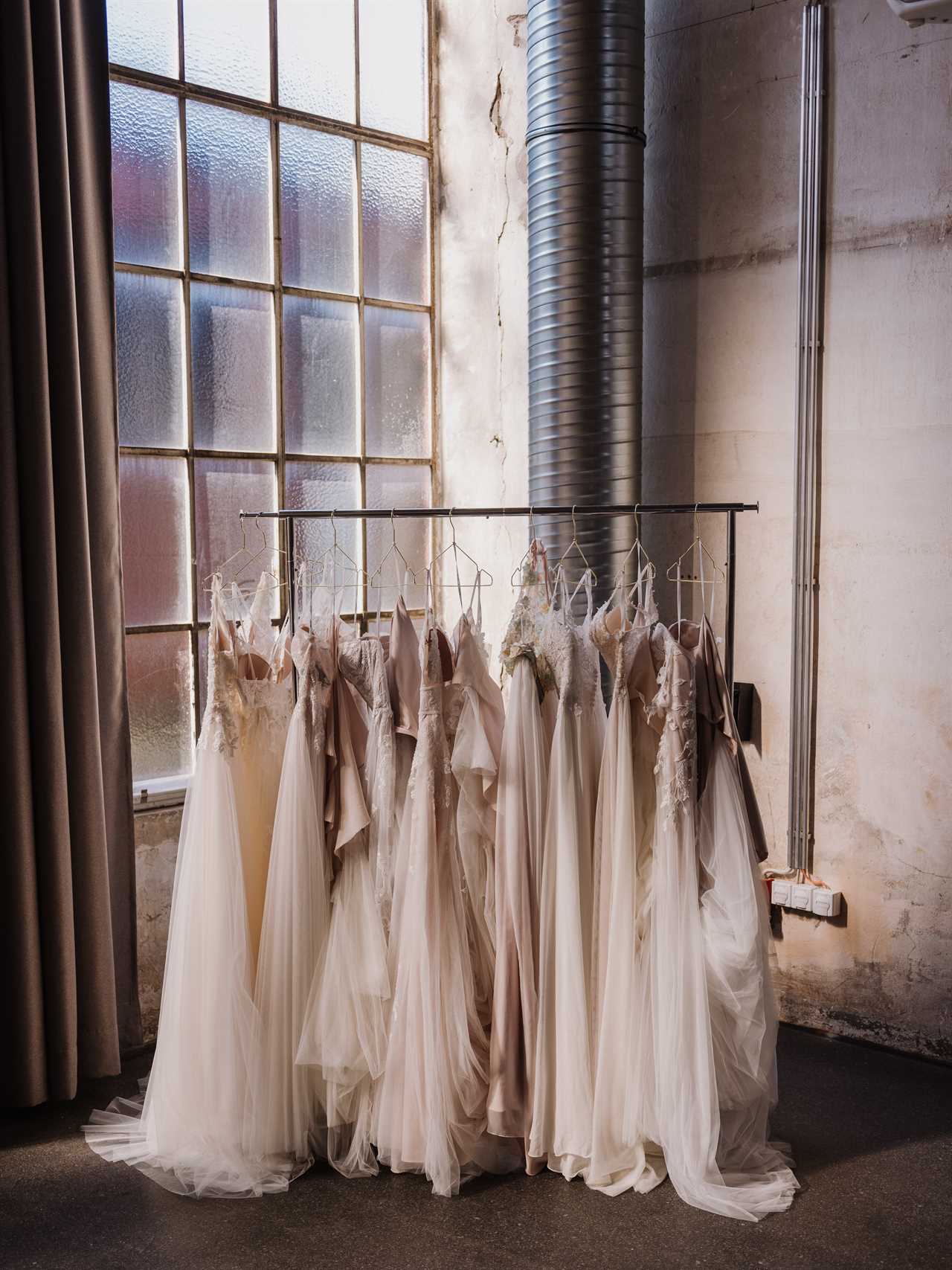 wedding gowns on a rack